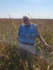 George Meyer standing in a meadow of big bluestem at the Buena Vista Wildlife Area, Portage County, WI
